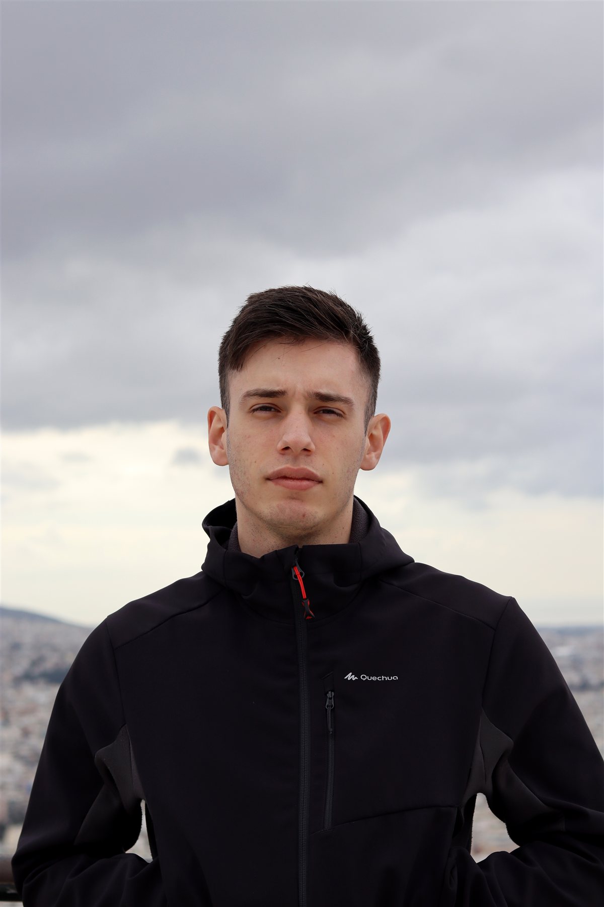 Emil Krosnov outdoors, wearing a black jacket